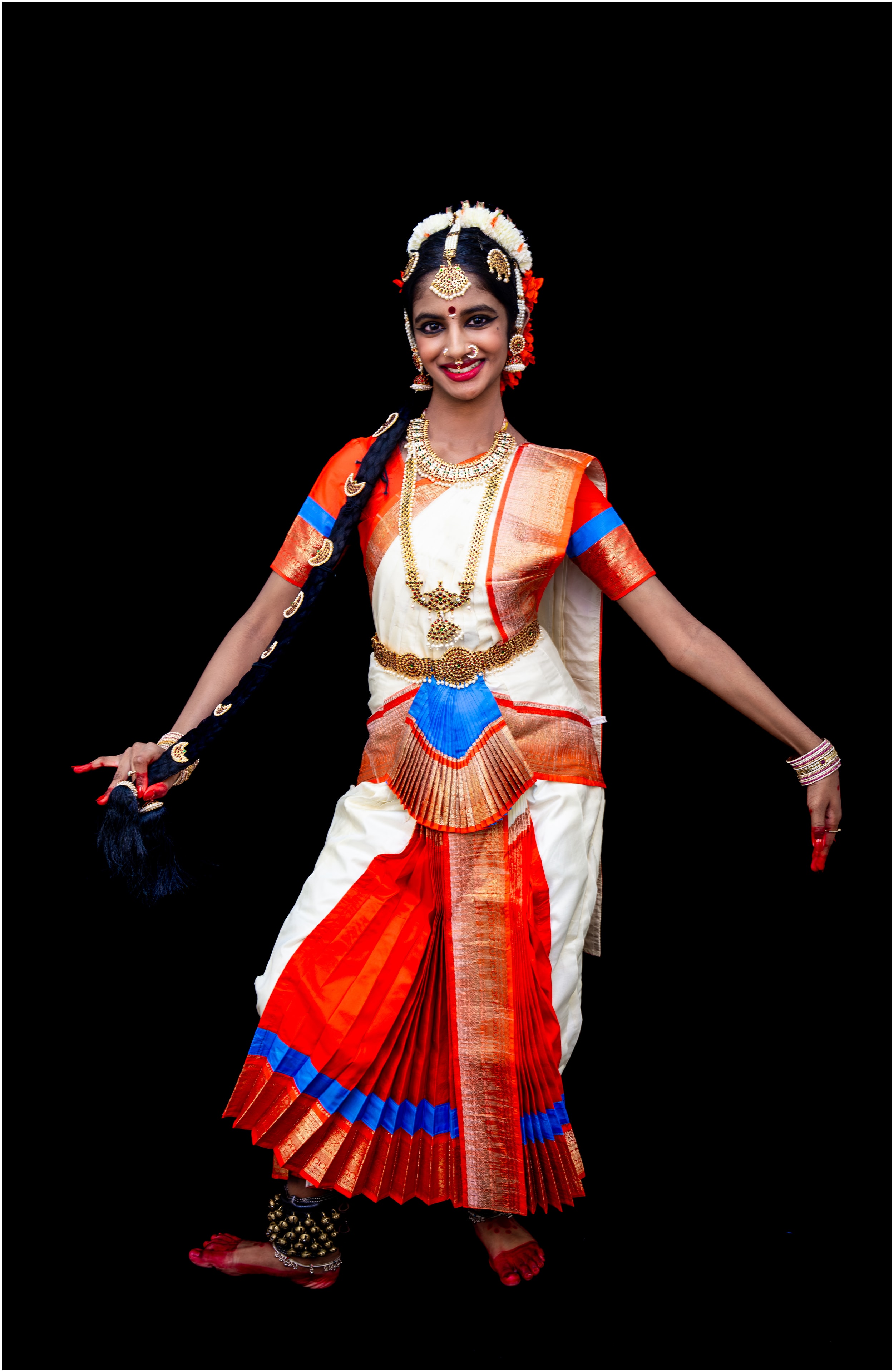 Pravesa Daruvu — white and red costume, joyful stance